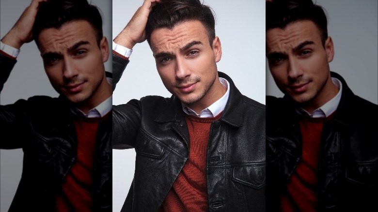 Man running hand through hair