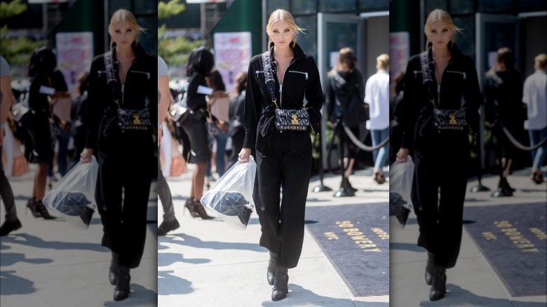 Woman wearing black boiler suit jumpsuit