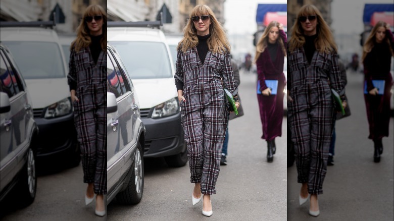 Woman wearing khaki boiler suit jumpsuit