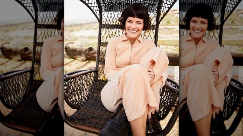 Woman wearing peach boiler suit jumpsuit