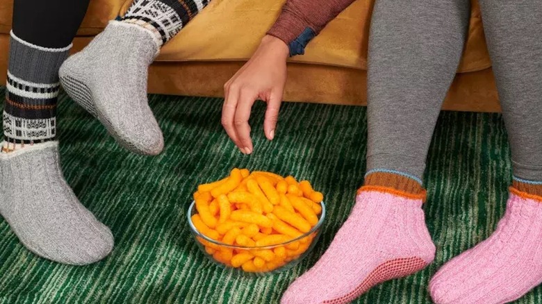 Two people wearing Bombas' socks