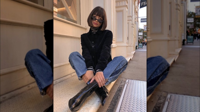 Girl wearing boots with boot-cut denim.