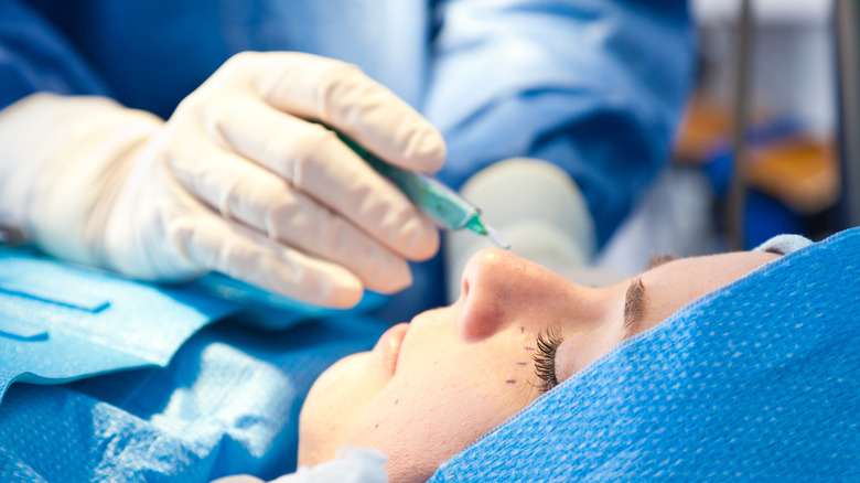 A woman having a facial cosmetic procedure done