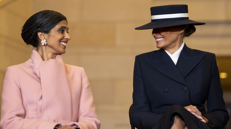 Usha Vance and Melania Trump smiling at each other