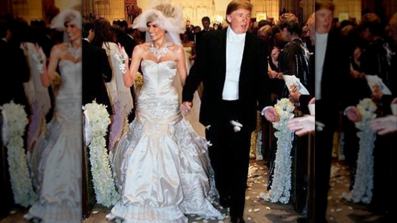 Melania Trump and Donald Trump walk down the aisle at their wedding