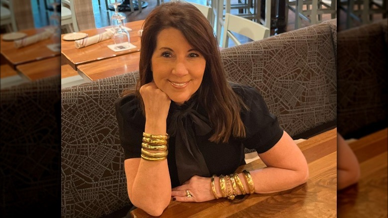 Woman poses wearing bangle stack 