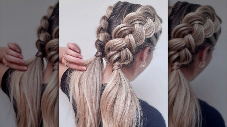 A woman with faux Dutch braid pigtails