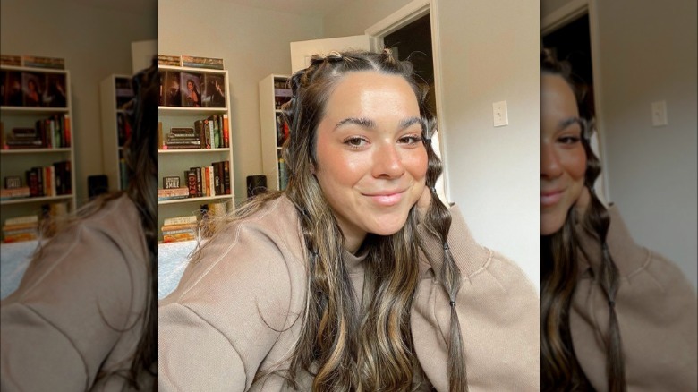 A woman with a two bubble accent braids