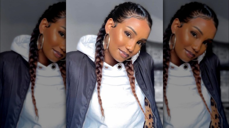 A woman with a two classic French braids