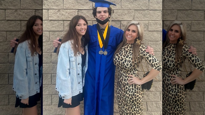 Brandi Passante posing in a leopard dress with her two kids at her son's graduation