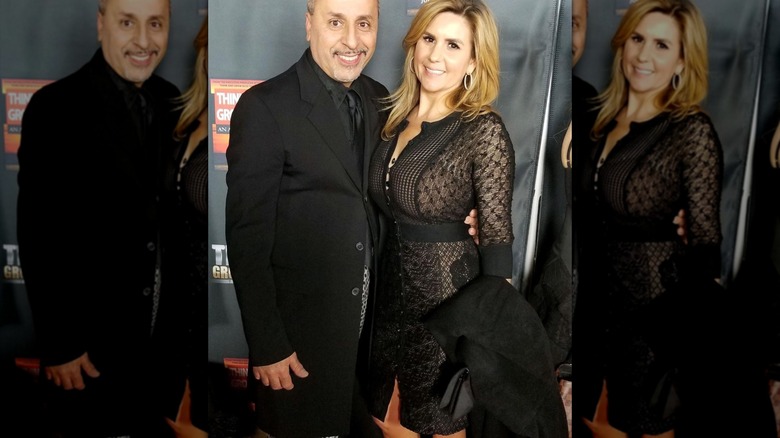 Brandi Passante posing in a black-lace dress on the red carpet