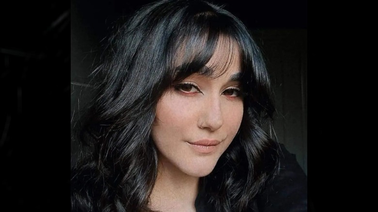 A woman with almost-black hair