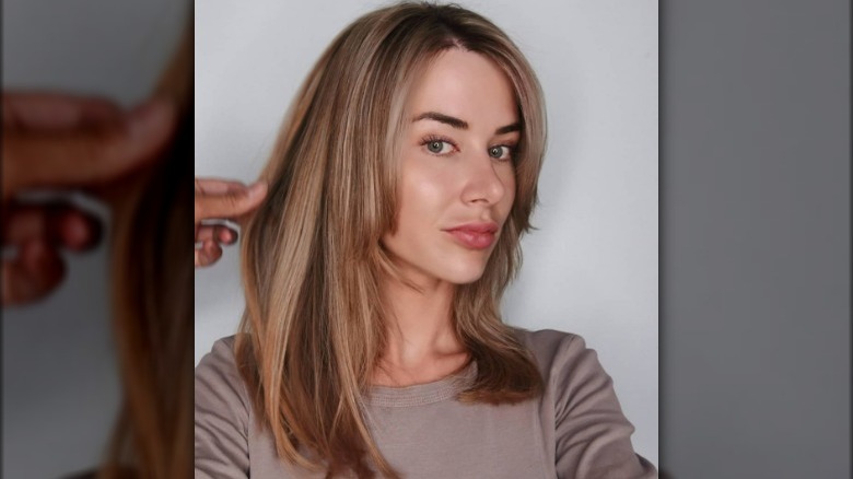 A woman with honey beige hair