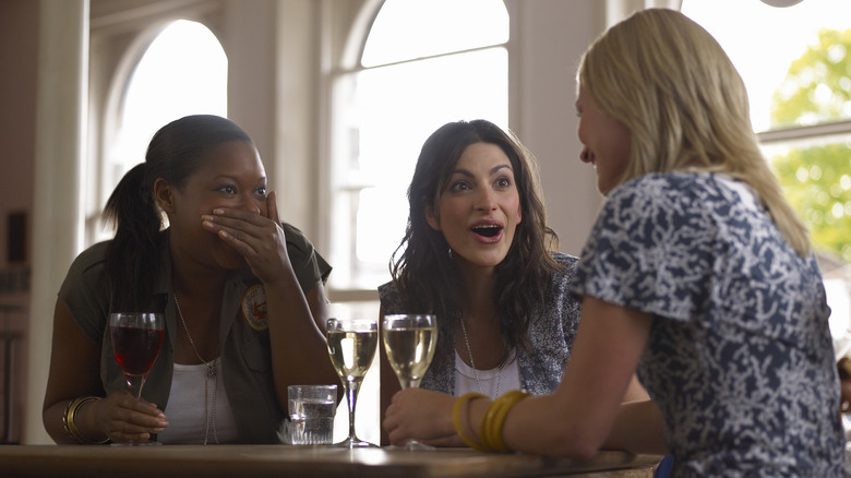 friends chatting and drinking wine