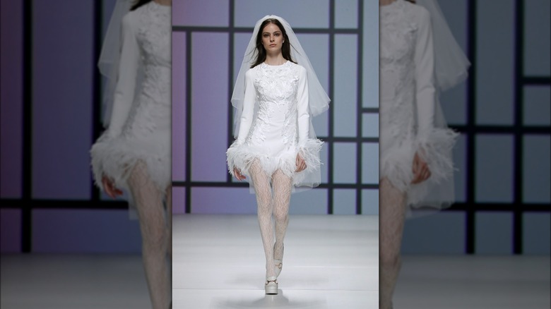 Woman in dress with feather trim