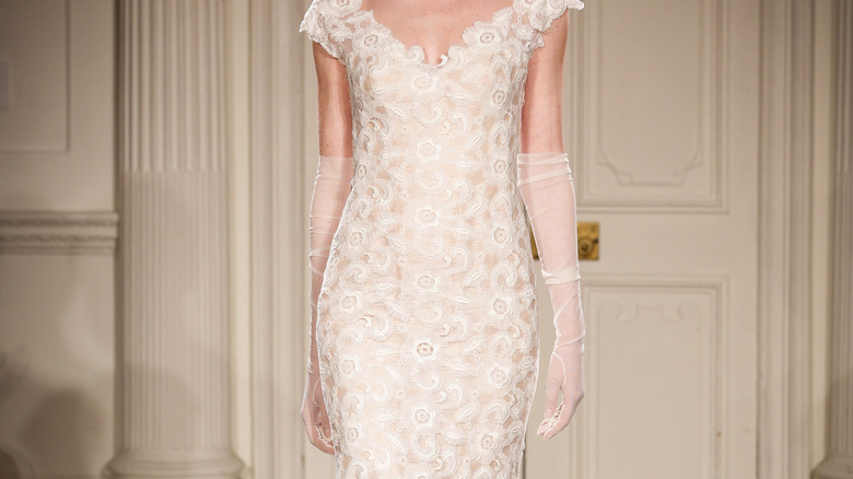 Bride wearing printed dress and gloves