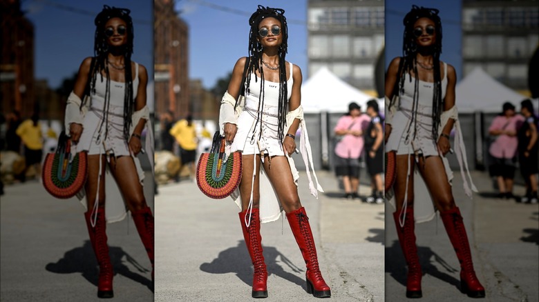 Woman wearing red knee-high boots