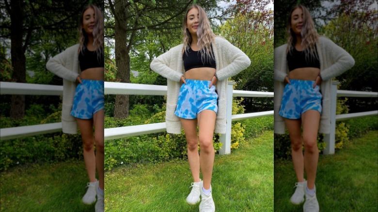 woman wearing blue tie dye shorts