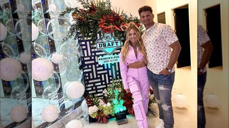 brittany mahomes wearing purple cargo pants