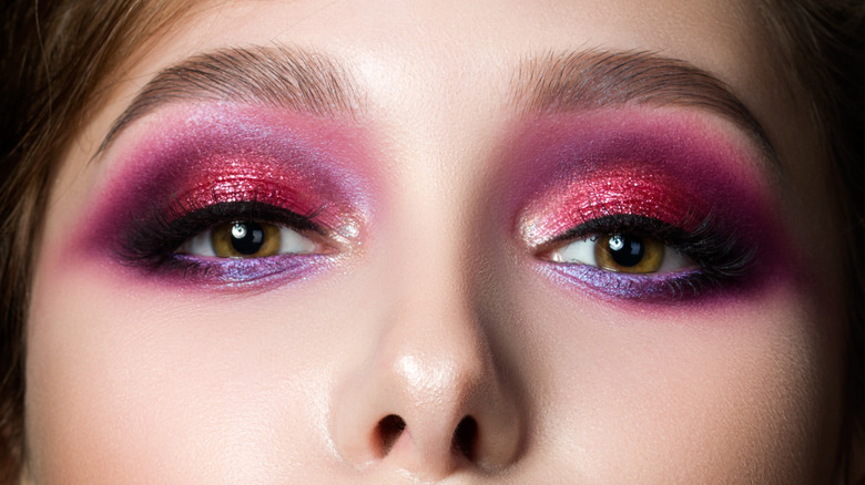 brown-eyed person wearing purple lower-liner