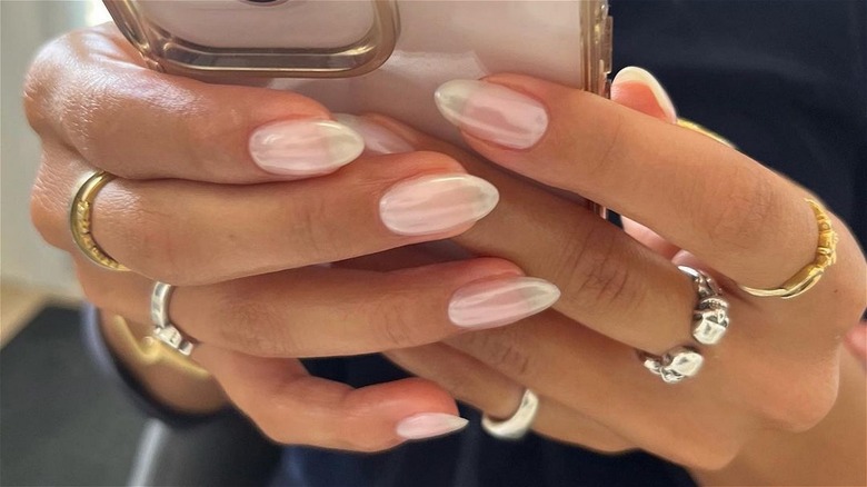 Hand with sheer pink nails