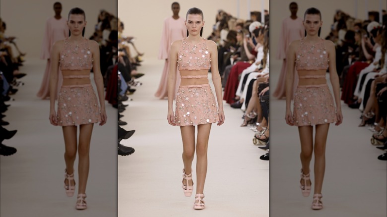 Model in pink scaled dress