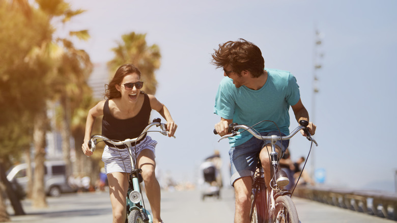 happy couple on bikes