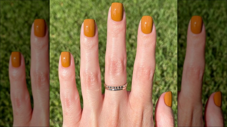 Pale hands with dark caramel square nails
