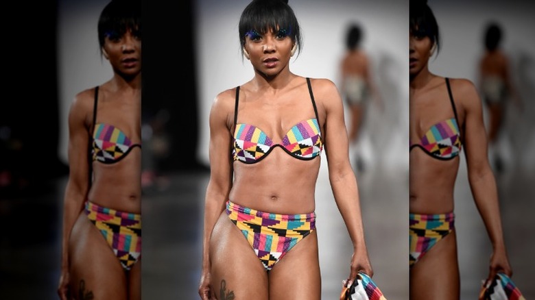 Model in bold patterned swimsuit