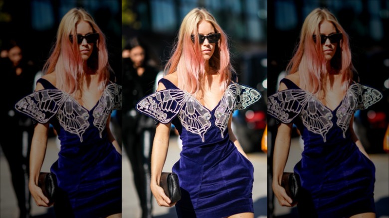 woman with metal butterfly accent dress