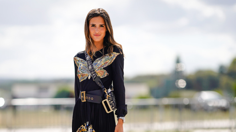 woman with embroidered butterfly top