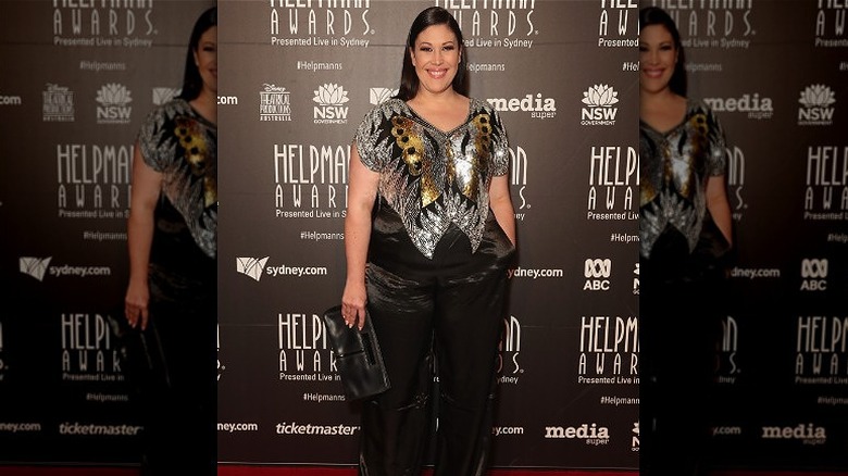 woman wearing sequined butterfly top