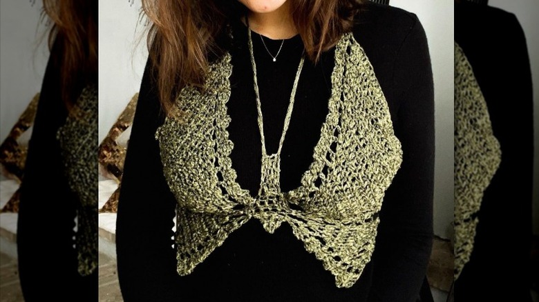 woman wearing butterfly top over top