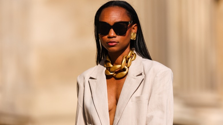 woman with vintage gold jewelry