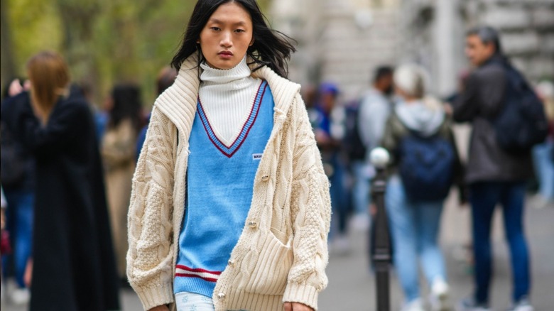 woman wearing cable-knit cardigan