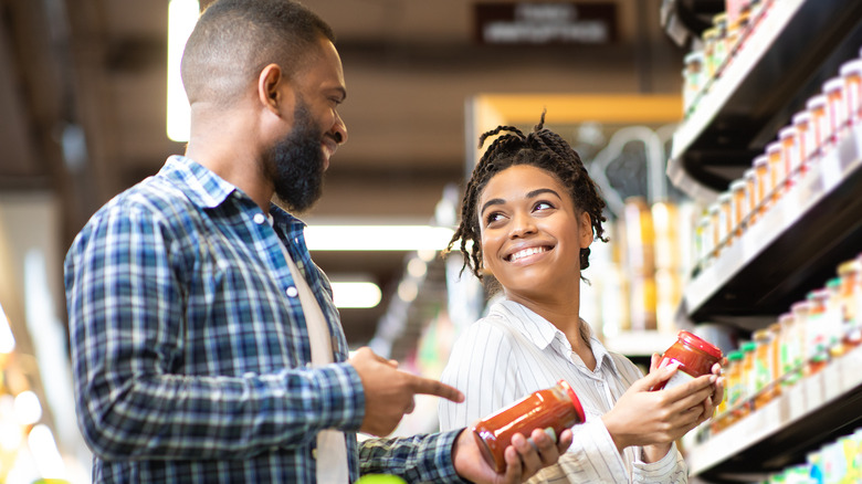 man and woman food shopping