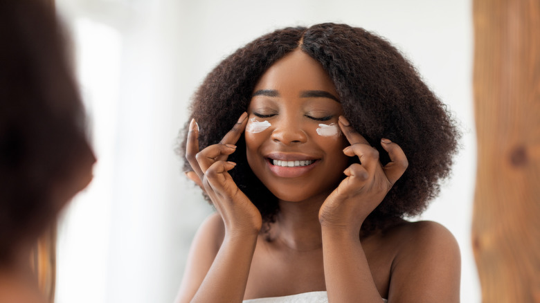 Woman wearing under-eye cream