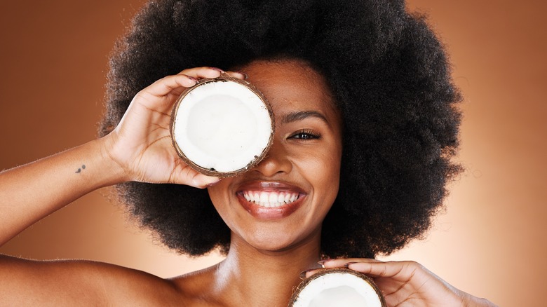 person with coconuts