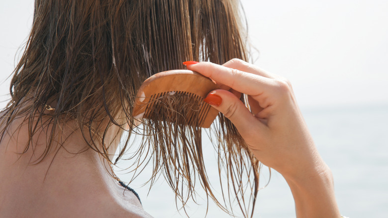 Woman combing her hair
