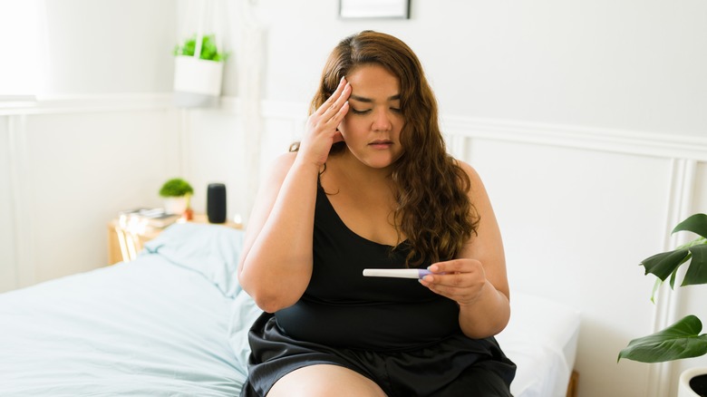 Woman upset at pregnancy test