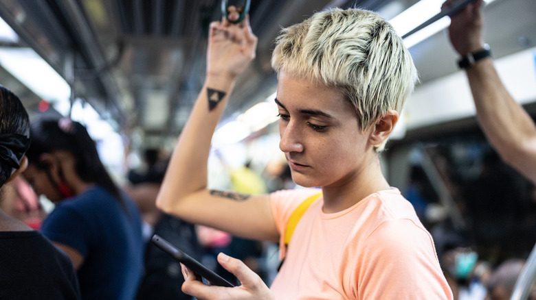 woman standing on train