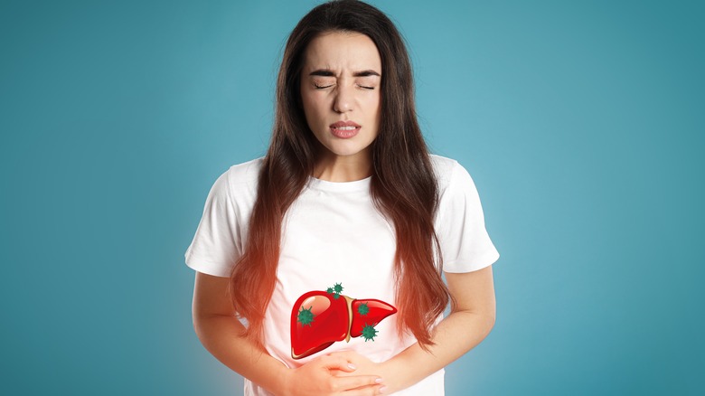 Woman displays pain in liver