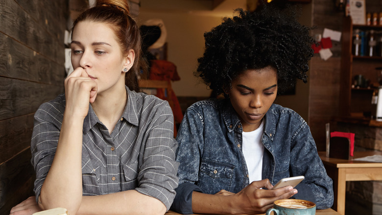 lesbian couple looking unhappy