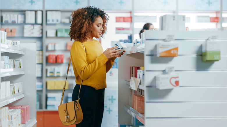 Woman browses at drugstore