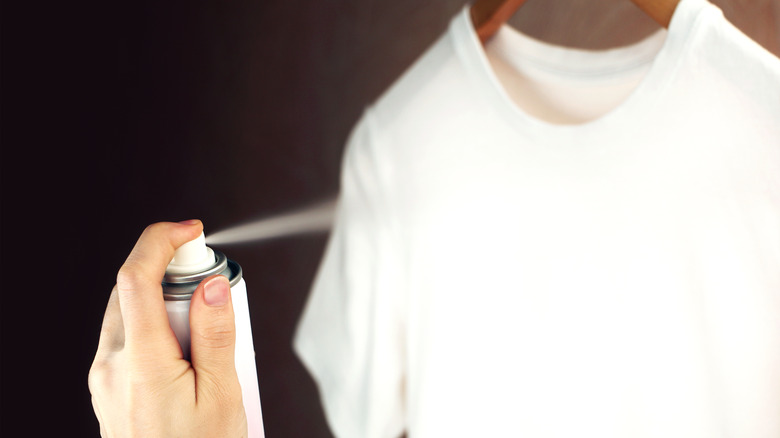 Spraying clothes with antistatic spray