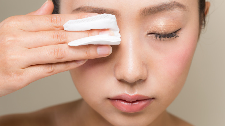 Woman removing mascara
