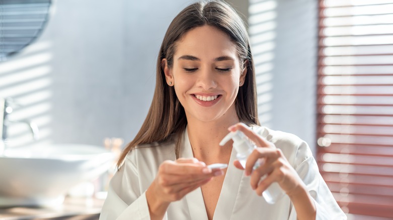 woman applying product to cotton