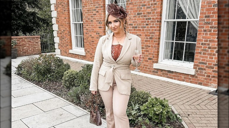 Woman in beige pantsuit