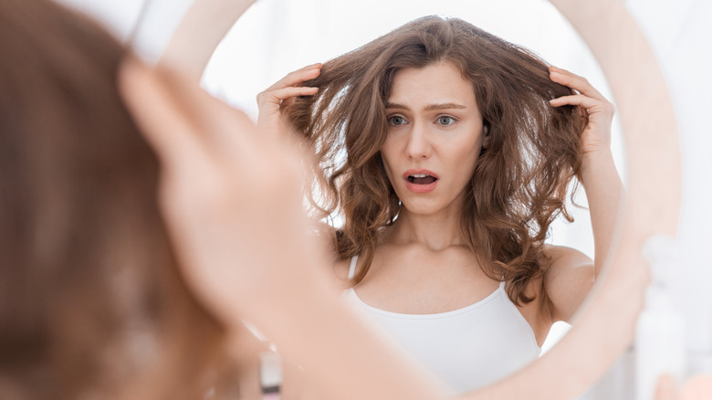 Woman holding her messy hair