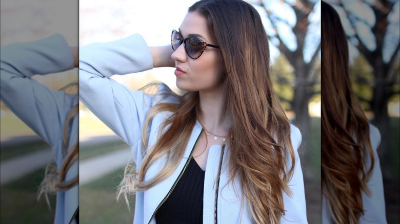 Auburn candle lights on long hair